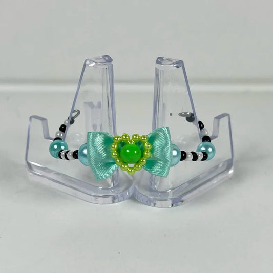 Blue, black, white, and green LPS crown