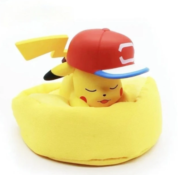 Figurine Pokémon endormi avec coussin